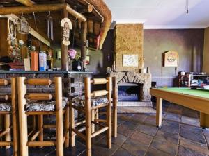 a bar with a table and a pool table at Blue Roan Country Lodge in Vlakfontein