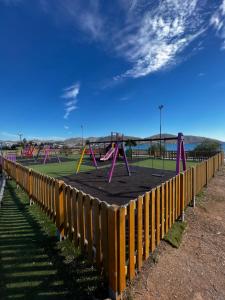 a park with a playground with pink play equipment at Thedreamlifehouse in Anavyssos