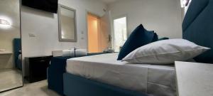 Postel nebo postele na pokoji v ubytování IL GIGLIO B&B