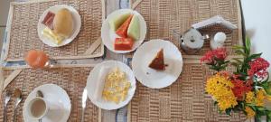 a group of plates of food on a table at Pousada Amar Lençóis Turismo in Barreirinhas
