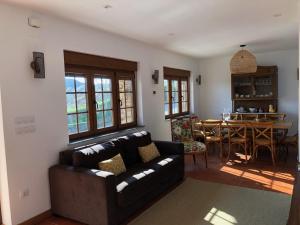 a living room with a couch and a table at Apartamentos Montemar in Navia