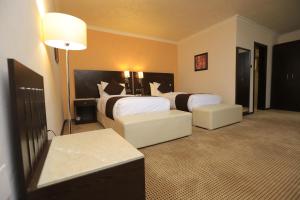 Uma cama ou camas num quarto em Cassiopeia Hotel