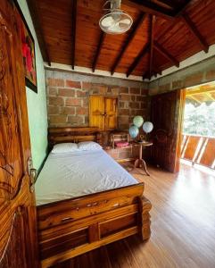 Postel nebo postele na pokoji v ubytování Hostal Vista Hermosa