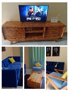 een woonkamer met een tv en een blauwe bank bij Modern Furnished Rooms with Netflix, Kitchen, Living room , Laundry DStv and Free WiFi in Kampala