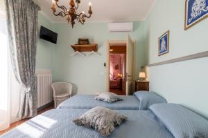 Säng eller sängar i ett rum på Vencaglia Casa del Nonno Bingheri