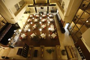 an overhead view of a lobby with tables and chairs at Cassiopeia Hotel in Addis Ababa