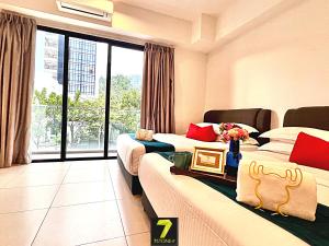a hotel room with two beds and a large window at 7Stonez Residences Midhills Genting Highlands in Genting Highlands