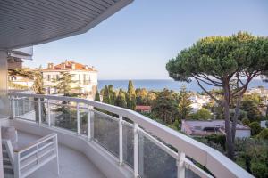 a balcony with a view of the ocean at Dream Apartment in Cannes