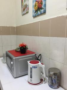 Η κουζίνα ή μικρή κουζίνα στο Little Cosy House @RB