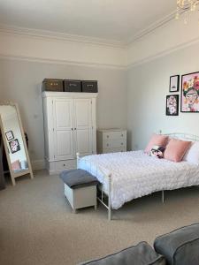a bedroom with a bed and a dresser at The Hole in the Wall, Midsomer Norton, Nr Bath & Longleat in Bath
