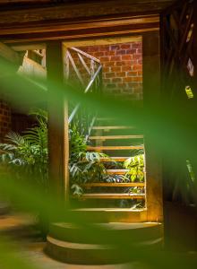 a set of stairs leading to a brick building at Christina House in Arusha