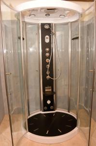 a shower with a glass enclosure in a bathroom at Hotel Soffio di Vento in Arbus