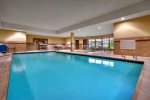 a large swimming pool in a hotel room at Holiday Inn Express Hotel & Suites Butte, an IHG Hotel in Butte