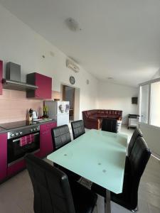 a kitchen with a table and chairs in a room at Beach house Korina in Sveta Nedelja