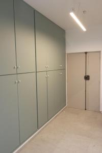 a large room with white cabinets and a closet at Guest House Rione Cappuccini in Sant'Agnello