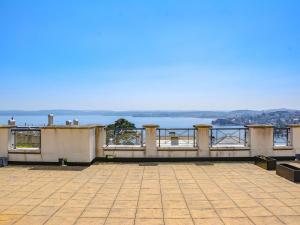 a balcony with a view of the water at Apartment 8, The Bay in Torquay