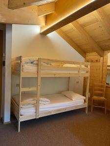 a bunk bed room with two bunk beds in a cabin at Locanda Bocchetto Sessera in Bielmonte