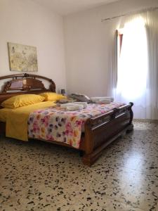 Ένα ή περισσότερα κρεβάτια σε δωμάτιο στο Villetta Vacanza dalla nonna