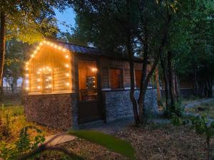 a small cabin with lights on the side of it at Orran Hotel and Resort in Solak