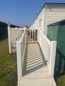a wooden ramp leading up to a house at Caravan 2 coral beach Ingoldmells 6 berth in Ingoldmells