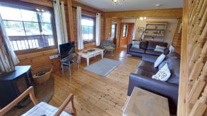 a living room with a couch and a table at Eirianfa in Menai Bridge +31 photos
