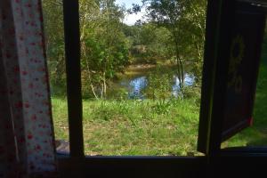 a view of a river from a window at Gypsy Sunrose in Bude