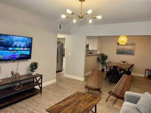 a living room with a couch and a dining room at Coral Gable 3BR house Parking & in Miami