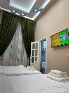 Postel nebo postele na pokoji v ubytování HOTEL DaMir