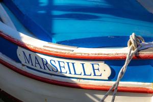 a boat with a license plate on the back of it at T2 Canebiere in Marseille