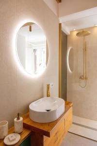 a bathroom with a white sink and a mirror at Repetita Juvant in Rome