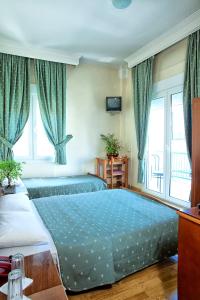 Postel nebo postele na pokoji v ubytování Keletron Hotel - Bike and motorcycle friendly hotel