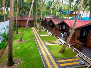 an aerial view of a resort with palm trees at Agonda Paradise in Agonda