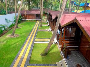 an aerial view of a resort with palm trees at Agonda Paradise in Agonda