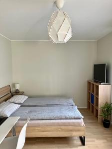 Кровать или кровати в номере Old Town Apartment