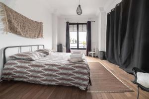 a bedroom with a bed with a laptop on it at Residence Le Paris - 57b Rue de Paris - Vichy in Vichy +23 photos