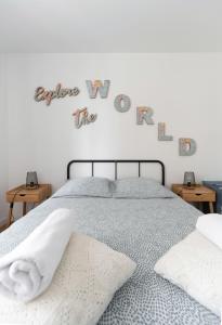 a bedroom with a bed and a sign that reads experience way the hardest at Residence Le Paris - 57b Rue de Paris - Vichy in Vichy