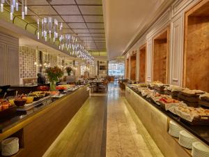 a buffet line in a restaurant with food on display at Fiesta Americana Merida in Mérida