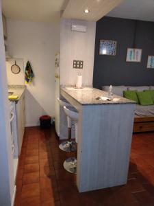 a kitchen with a island in the middle of a room at Queen Bariloche in San Carlos de Bariloche