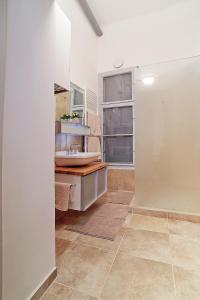 a bathroom with a sink and a mirror at Beautiful apartment in 7th district in Budapest