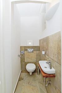 a bathroom with a toilet and a sink at Beautiful apartment in 7th district in Budapest