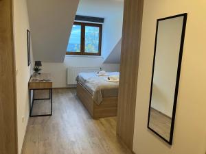 Łóżko lub łóżka w pokoju w obiekcie Apartmán Nahoře