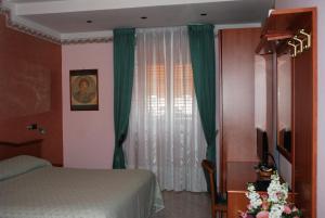 Postel nebo postele na pokoji v ubytování Hotel Grillo Verde