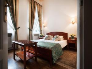 Posteľ alebo postele v izbe v ubytovaní Aparthotel Karmel