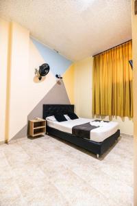 Voodi või voodid majutusasutuse HOTEL CALLE REAL SUITE toas