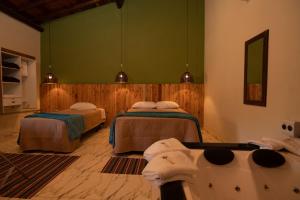 Ein Bett oder Betten in einem Zimmer der Unterkunft Pousada Pitauá