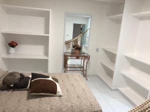 Ένα ή περισσότερα κρεβάτια σε δωμάτιο στο Aluguéis por temporada em Campina Grande