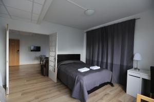Postel nebo postele na pokoji v ubytování 100 Iceland Hotel