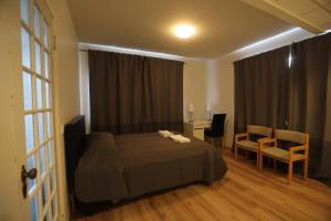 Postel nebo postele na pokoji v ubytování 100 Iceland Hotel
