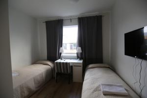 Postel nebo postele na pokoji v ubytování 100 Iceland Hotel