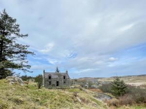 an old house on top of a hill at Rhianchaitel House in Bettyhill